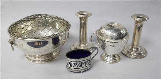A modern silver rose bowl, a planished silver mug and cover, a pair of silver dwarf candlesticks and a silver mustard (no lid).